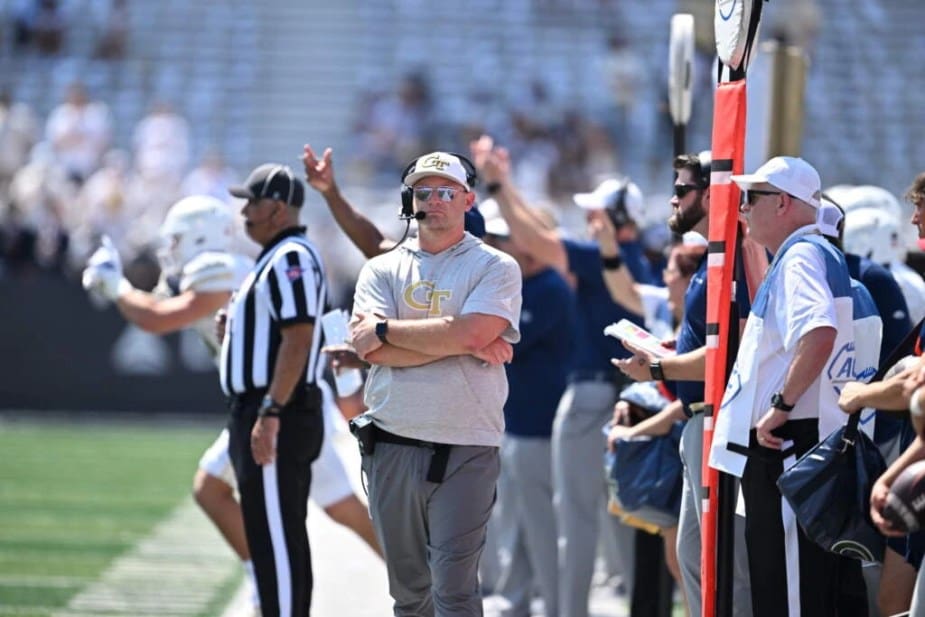 Georgia Tech head coach Brent Key coaching intensely on the sideline during the team's upset victory over #12 Clemson