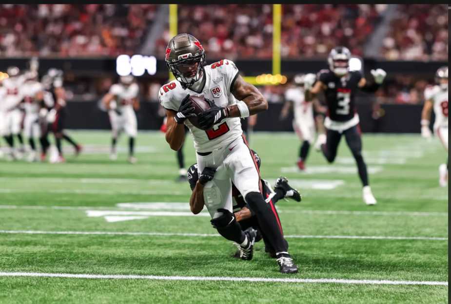 Tampa Bay Buccaneers wide receiver #2 Egbuka making a crucial 25-yard touchdown catch during NFL game against Atlanta Falcons