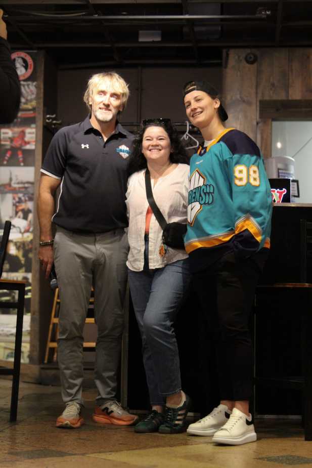 New York Sirens GM Pascal Daoust, a fan, and draft pick posing together