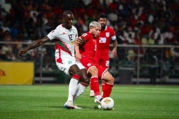 9/4/2025 Franklin Essed Stadium, Paramaribo, Suriname Leo Abena Challenges the ball Mandatory Credit FEPAFUT