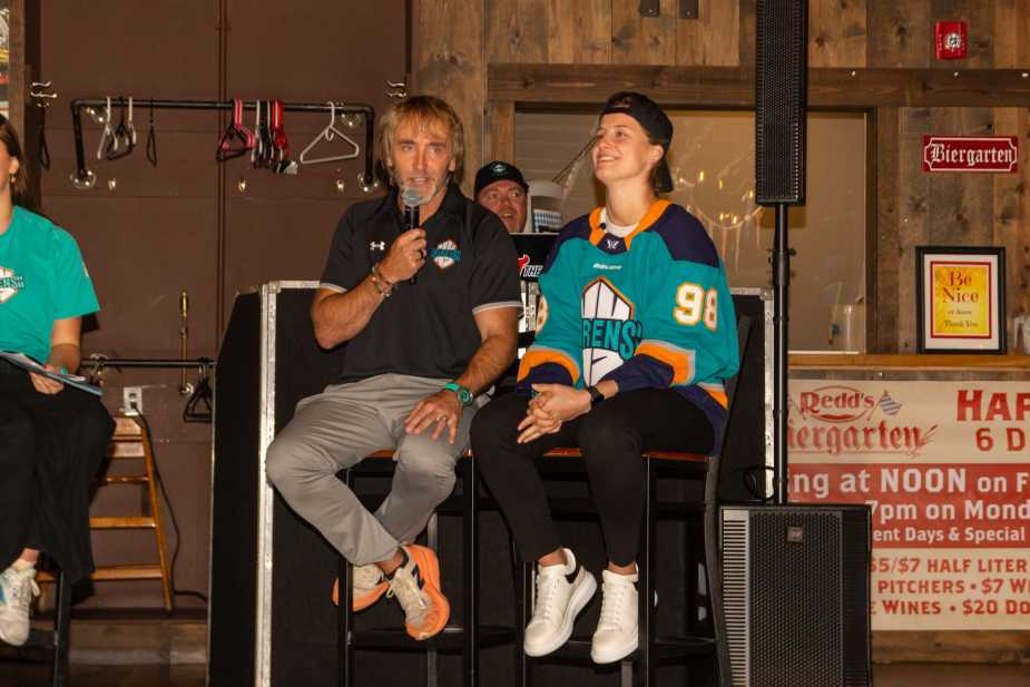 New York Sirens draft pick and GM on stage during Q&A session, draft pick laughing