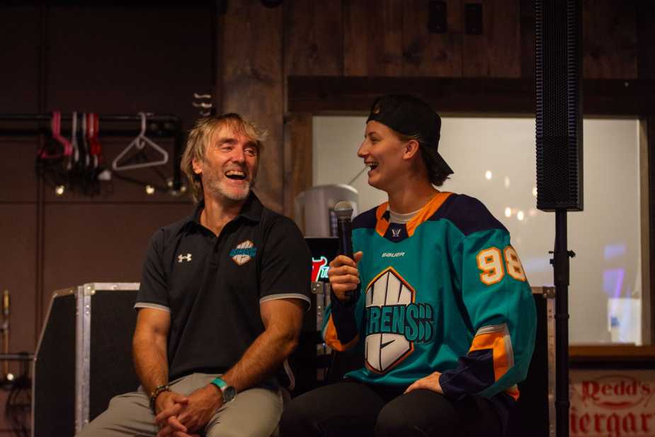 New York Sirens GM Pascal and draft pick Kristyna laughing together on stage