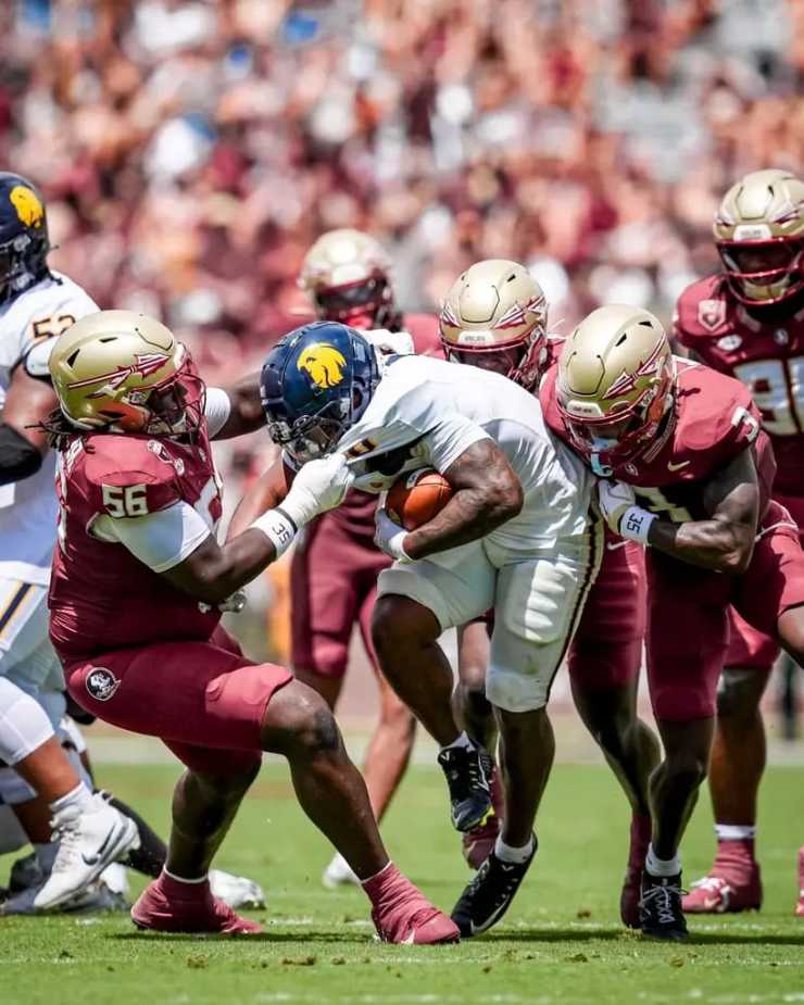FSU defense swarms East Texas A&M ball carrier during dominant 77-3 victory at Doak Campbell Stadium