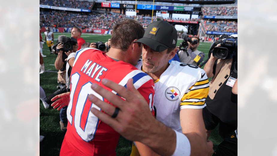 New England Patriots quarterback Drake Maye #10 and Pittsburgh Steelers quarterback Aaron Rodgers #8 embracing at midfield after Steelers 21-14 victory at Gillette Stadium