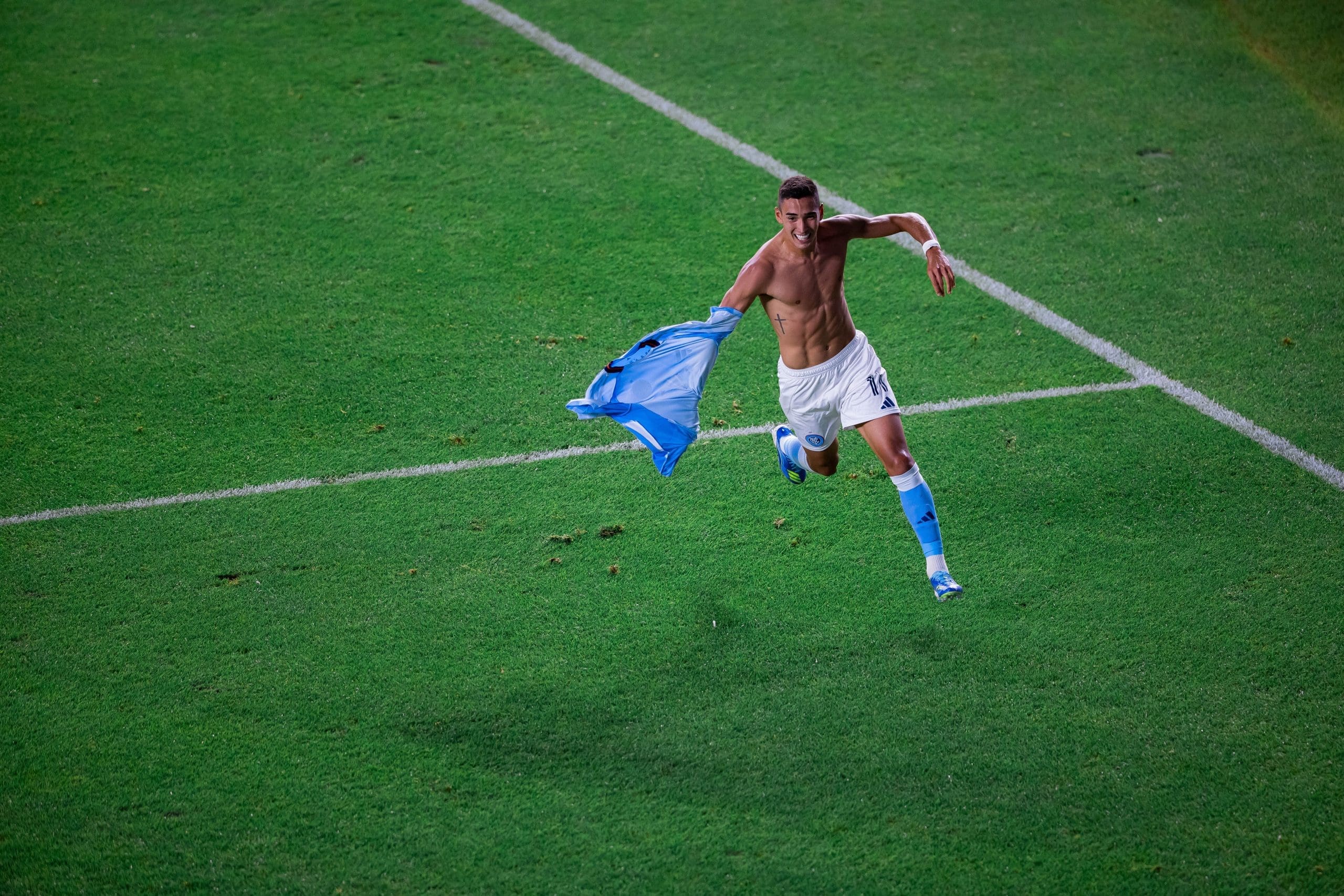 NYCFC forward Julián Fernández celebrates shirtless while running with his jersey after scoring stoppage-time winner against Columbus Crew at Yankee Stadium