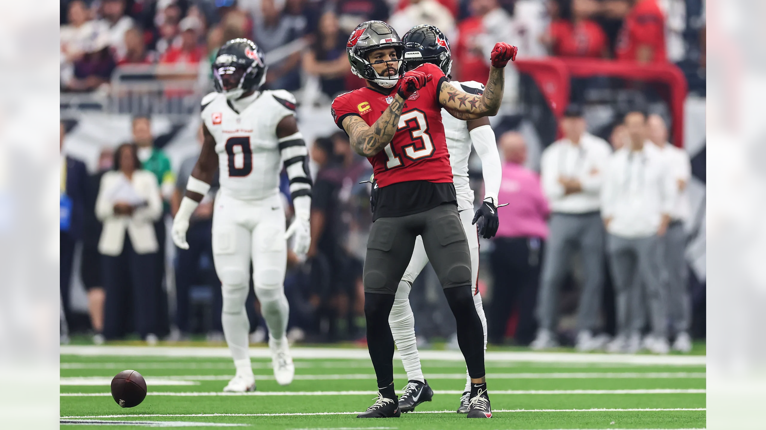 Tampa Bay Buccaneers wide receiver Mike Evans (#13) celebrates after making a crucial reception against the Houston Texans defense during their 20-19 victory