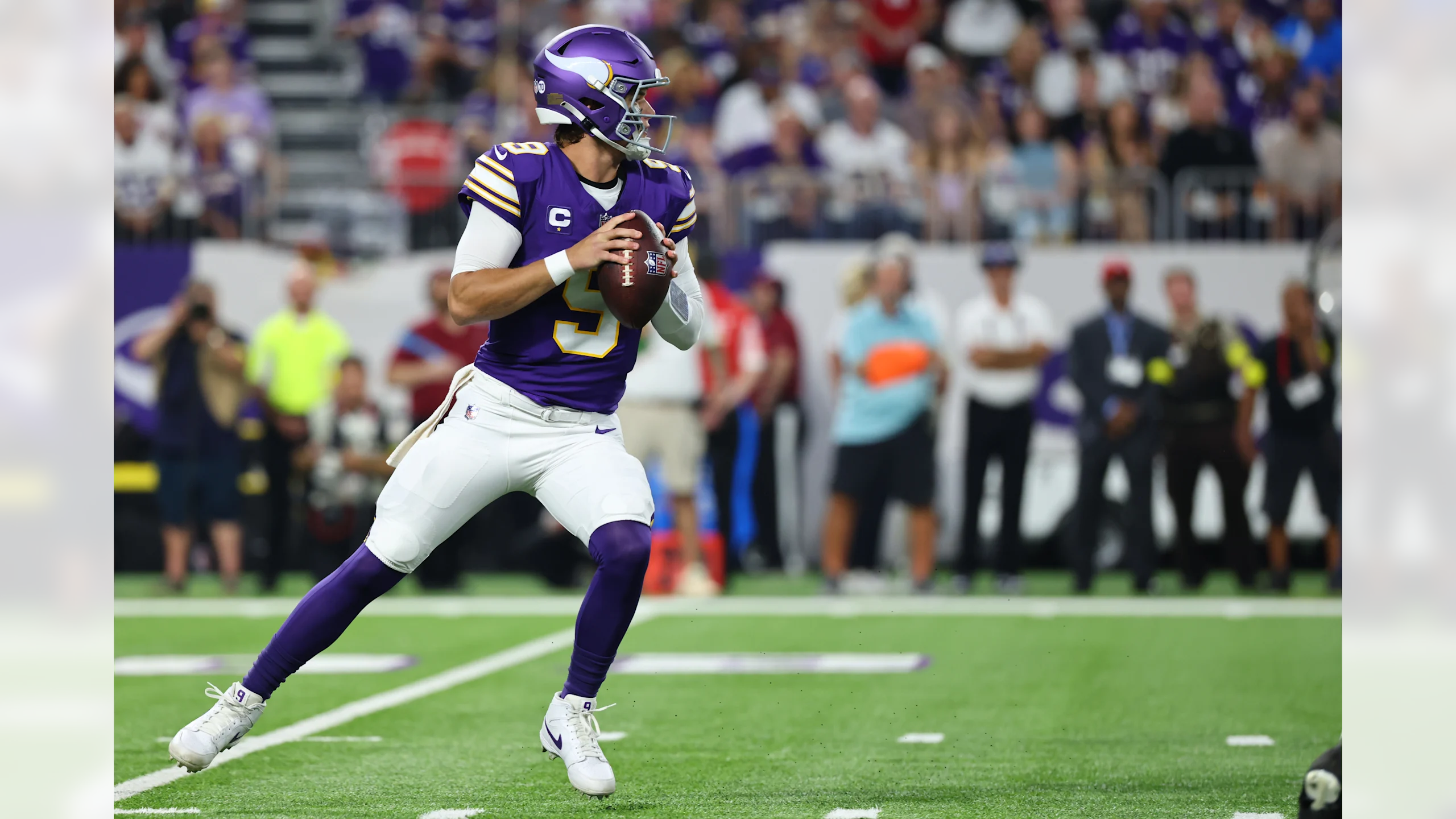 Minnesota Vikings quarterback J.J. McCarthy drops back in the pocket to throw a pass during the team's Week 2 Sunday Night Football game against the Atlanta Falcons at U.S. Bank Stadium