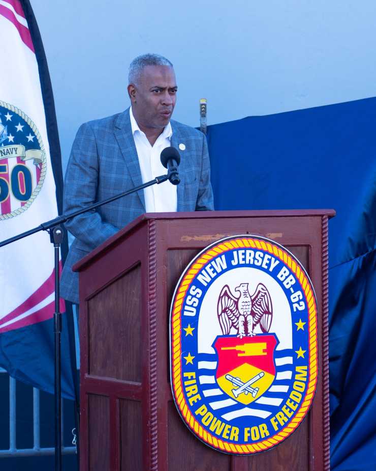 Mayor Victor Carstarphen of Camden, New Jersey, speaks at USS Enterprise stern plate unveiling ceremony during Navy 250th anniversary celebration on October 10, 2025.