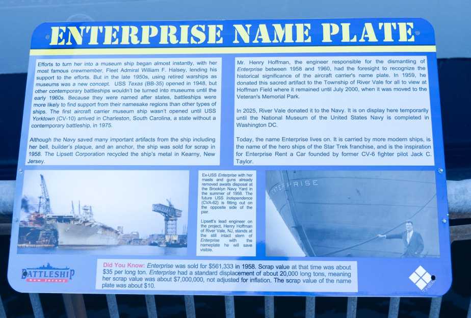 Educational plaque titled "Enterprise Name Plate" detailing the history of USS Enterprise (CV-6) stern plate preservation by William Henry Hoffman and donation by Rivervale Township to the National Museum of the United States Navy, displayed at Battleship New Jersey on October 10, 2025.