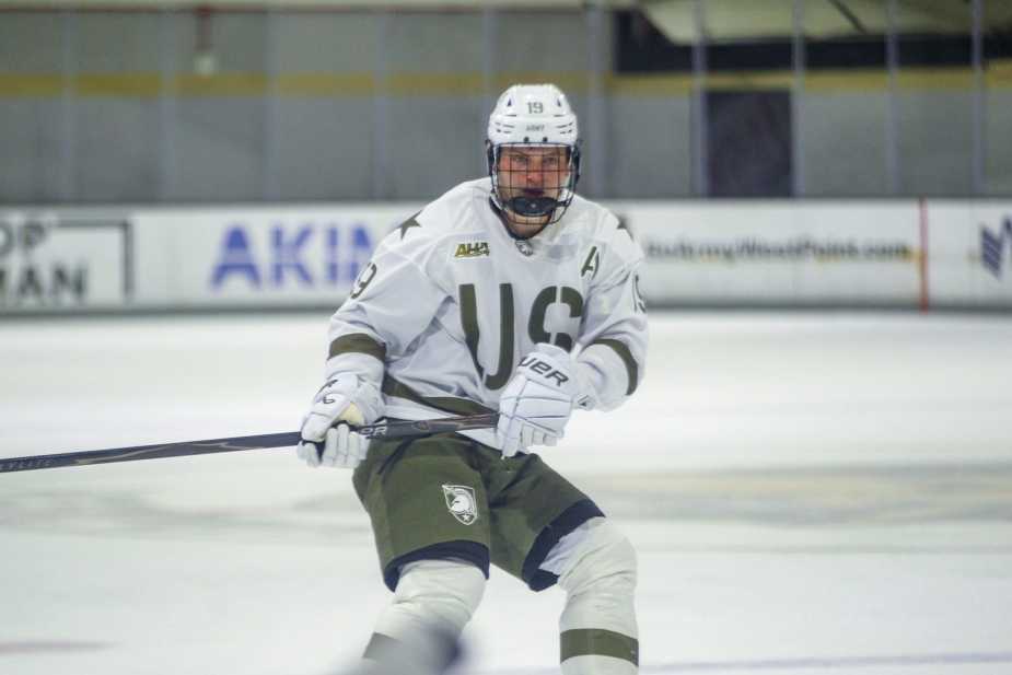Army West Point forward Nik Hong (#19) skates with the puck during the Black Knights' 5-2 victory over Holy Cross at Tate Rink on October 24, 2025