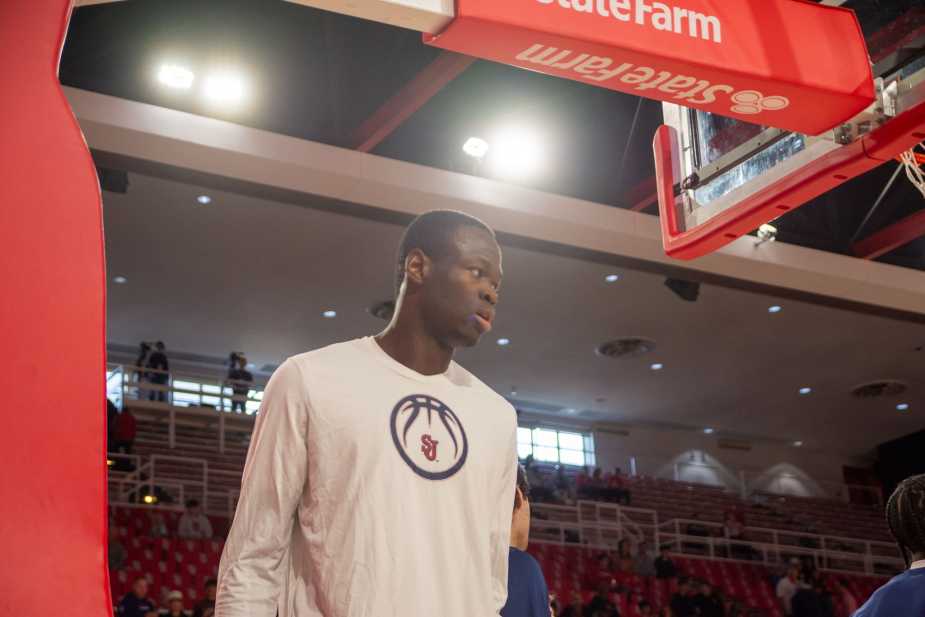 St. John's Red Storm center Handje Tamba from the Republic of the Congo prepares for the exhibition game against Towson at Carnesecca Arena. Tamba's size, athleticism, and defensive presence are key to St. John's' championship aspirations.