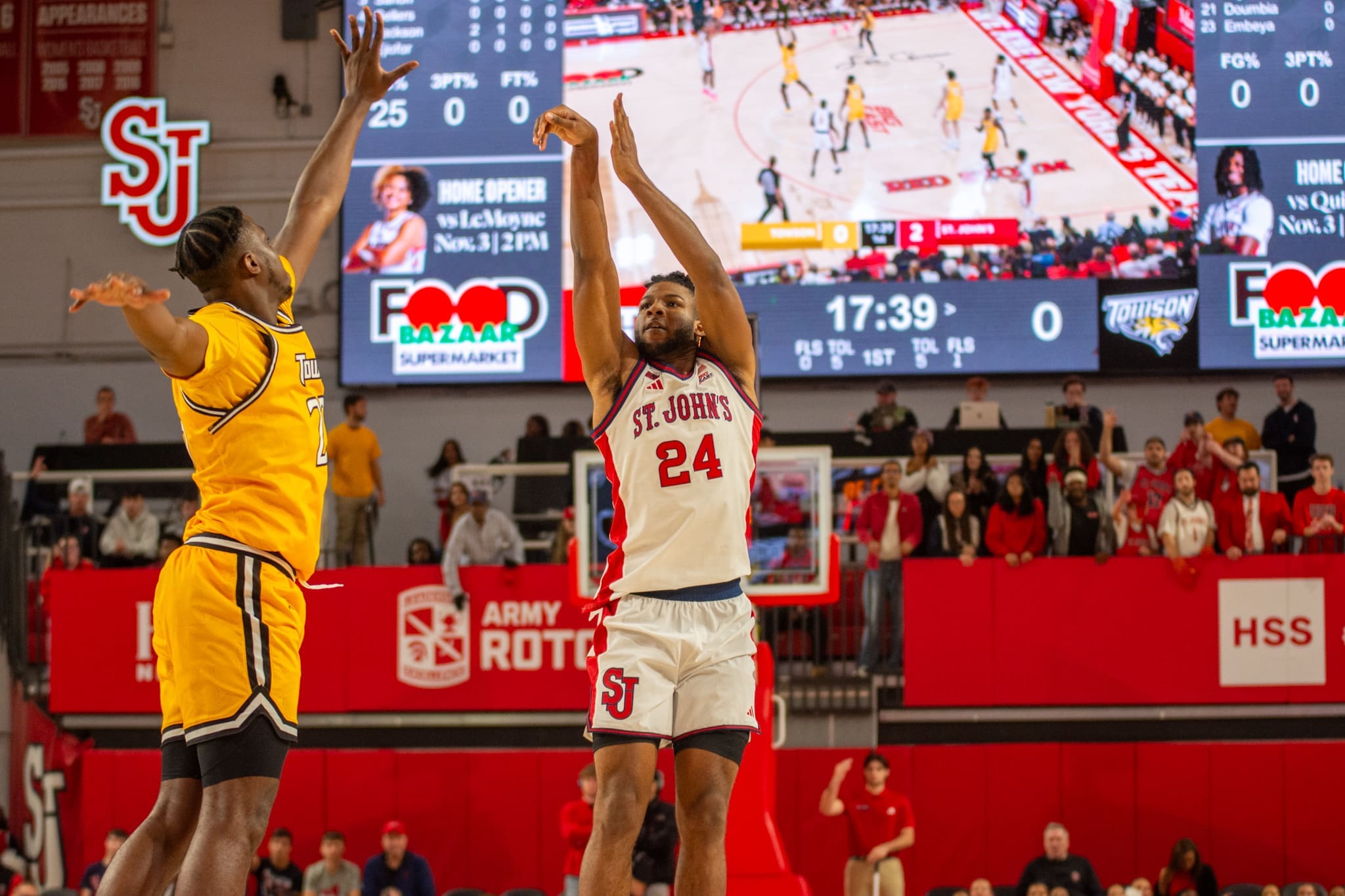 St. John's Red Storm forward Zuby Ejiofor launches a deep jumper against Towson defender during the exhibition game at Carnesecca Arena. Ejiofor, the BIG EAST Most Improved Player, led St. John's' second-half comeback in the 73-63 victory.