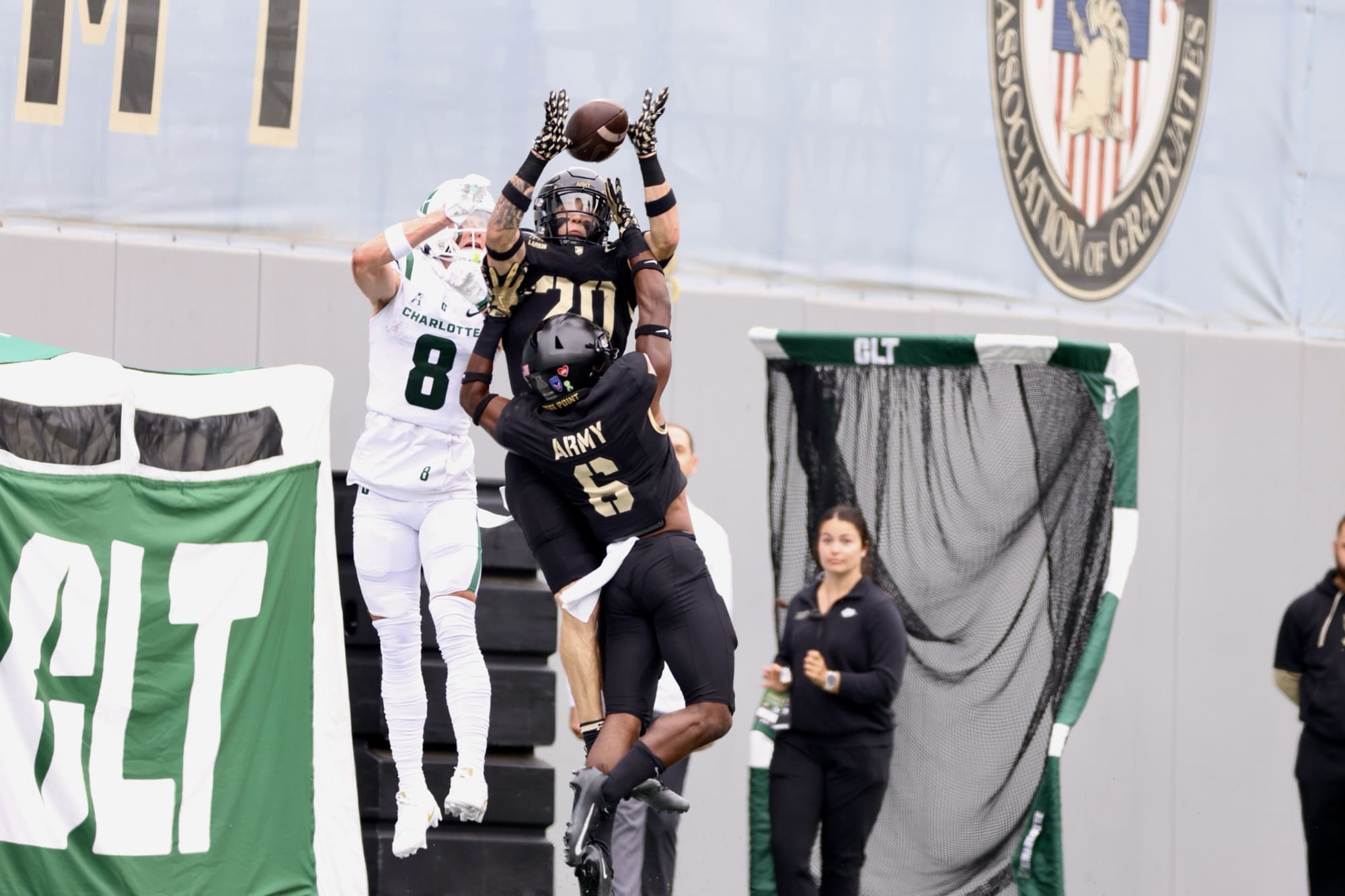 Army West Point defensive backs break up a pass intended for Charlotte receiver during the Black Knights' 24-7 victory at Michie Stadium on October 11, 2025