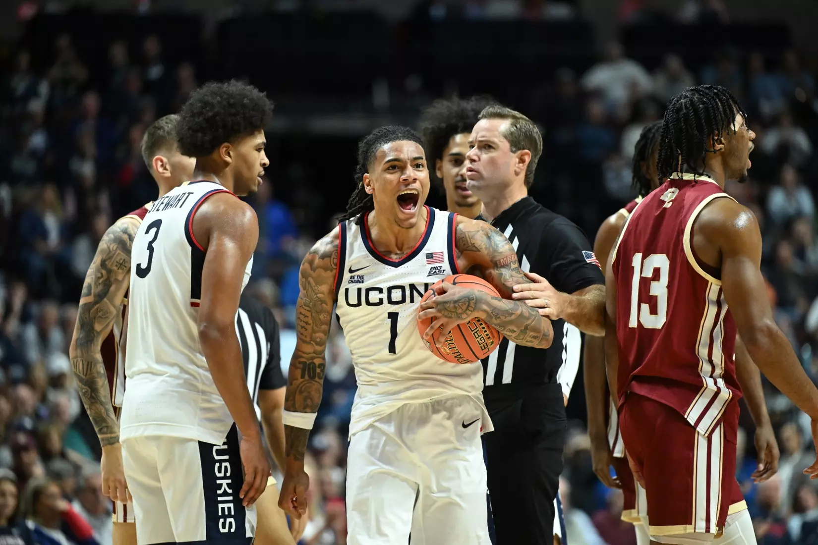 UConn Huskies guard Solo Ball (#1) celebrates with the basketball in his hand during the Hall of Fame Exhibition game against Boston College at Mohegan Sun Arena on October 13, 2025