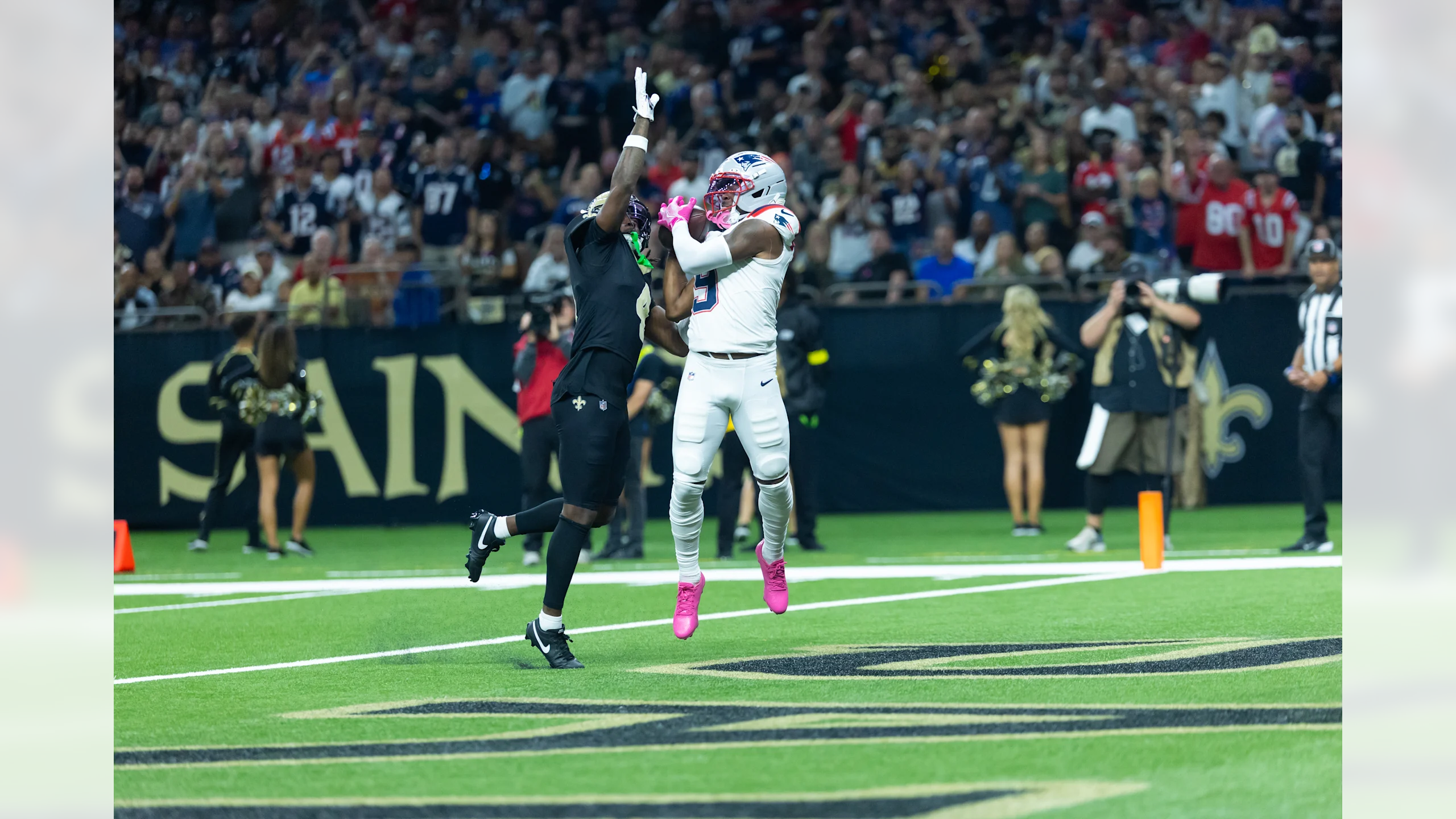 New England Patriots wide receiver Kayshon Boutte (9) makes a contested touchdown catch in the end zone over New Orleans Saints defensive back during Week 6 NFL game at Caesars Superdome on October 12, 2025