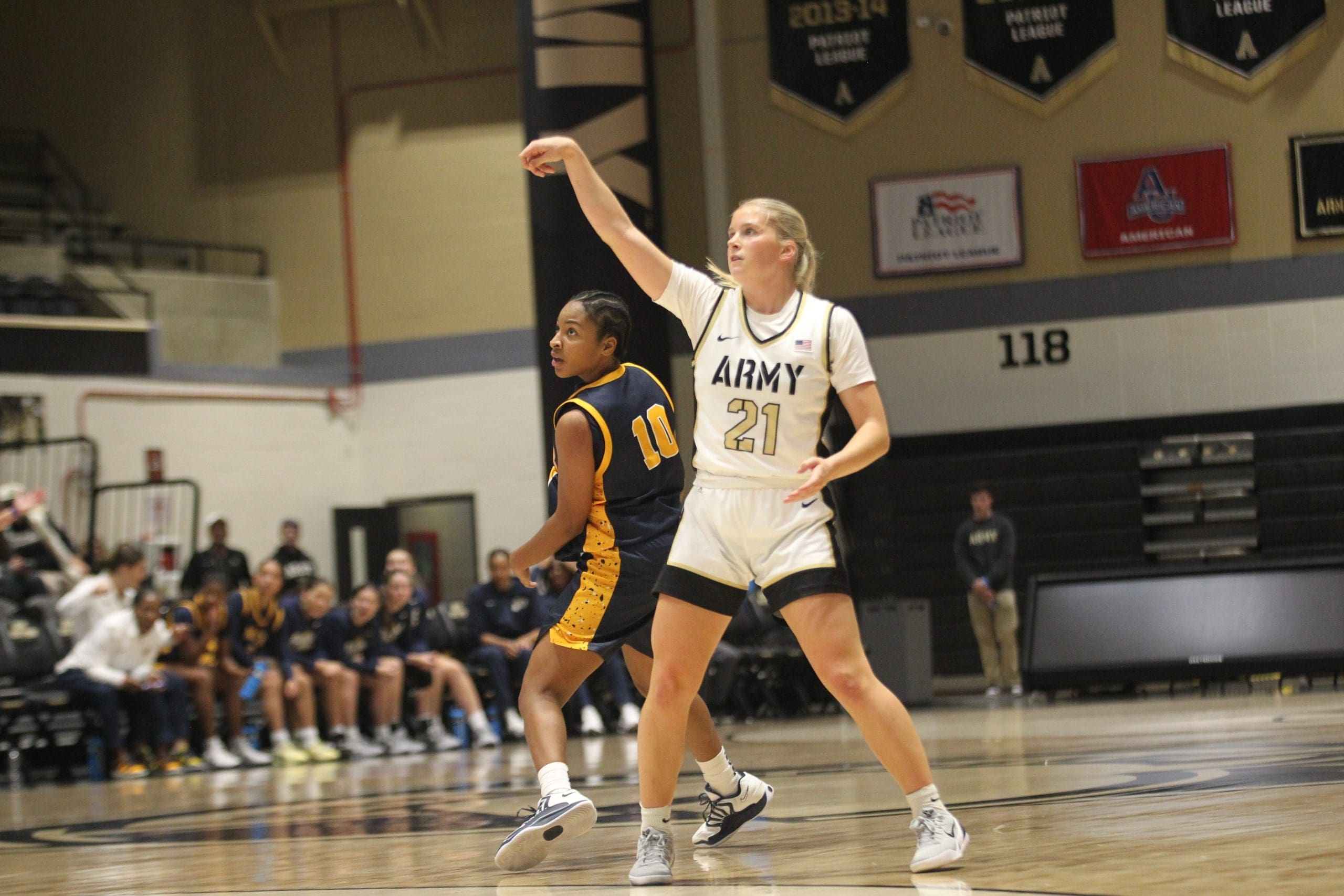 Army senior guard Reese Ericson shooting a three-pointer during game against Pace University