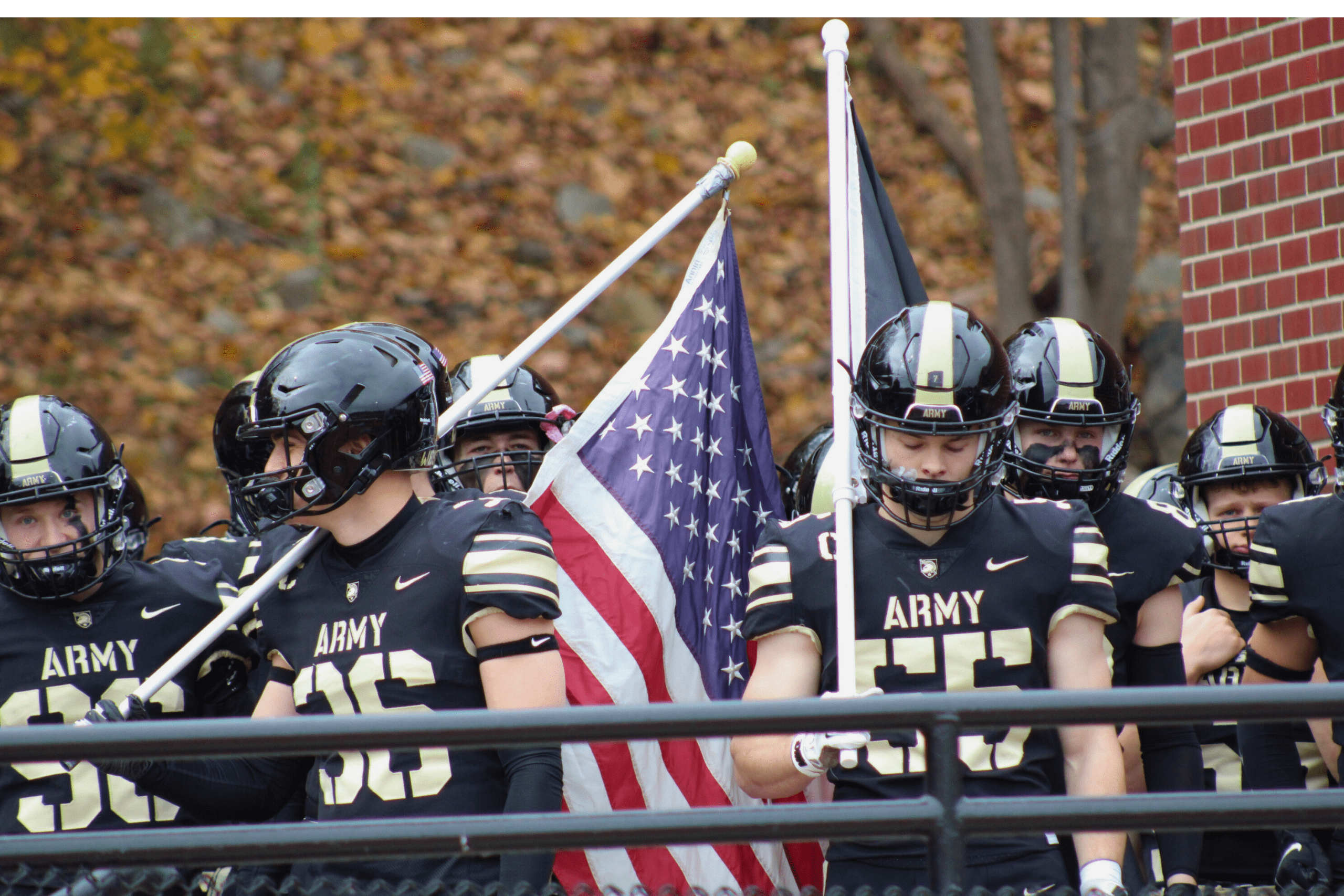 Army Black Knights sprint football players hold American flag before running onto field at Shea Stadium for rivalry game against Navy Midshipmen