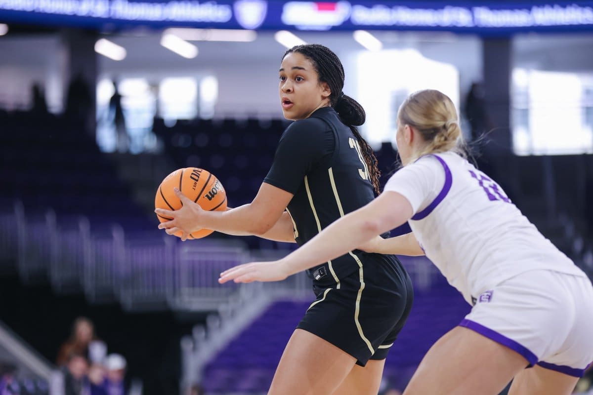 Army West Point junior forward Kya Smith (#30) dribbles the basketball at the top of the key during the Black Knights' 67-61 comeback victory over St. Thomas at Lee & Penny Anderson Arena on November 8, 2025