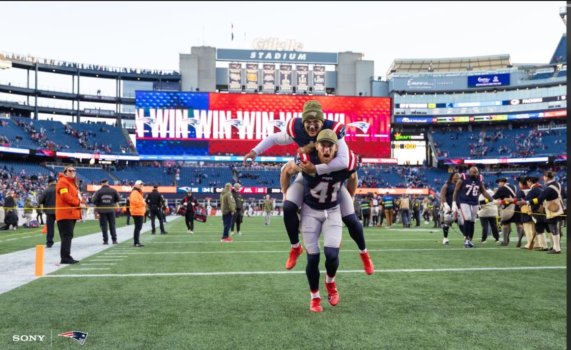 New England Patriots players Andy Borregales and Brenden Schooler celebrate 24-23 victory over the Atlanta Falcons in the end zone at Gillette Stadium during the Salute to Service game on November 2, 2025