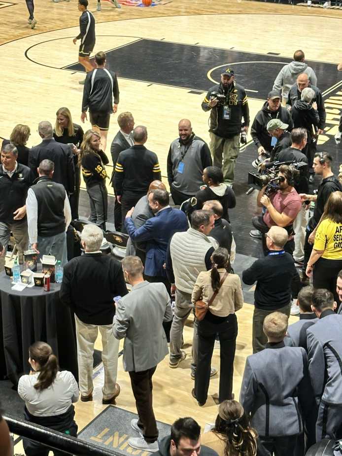 Coach K shares a hug with West Point Administration