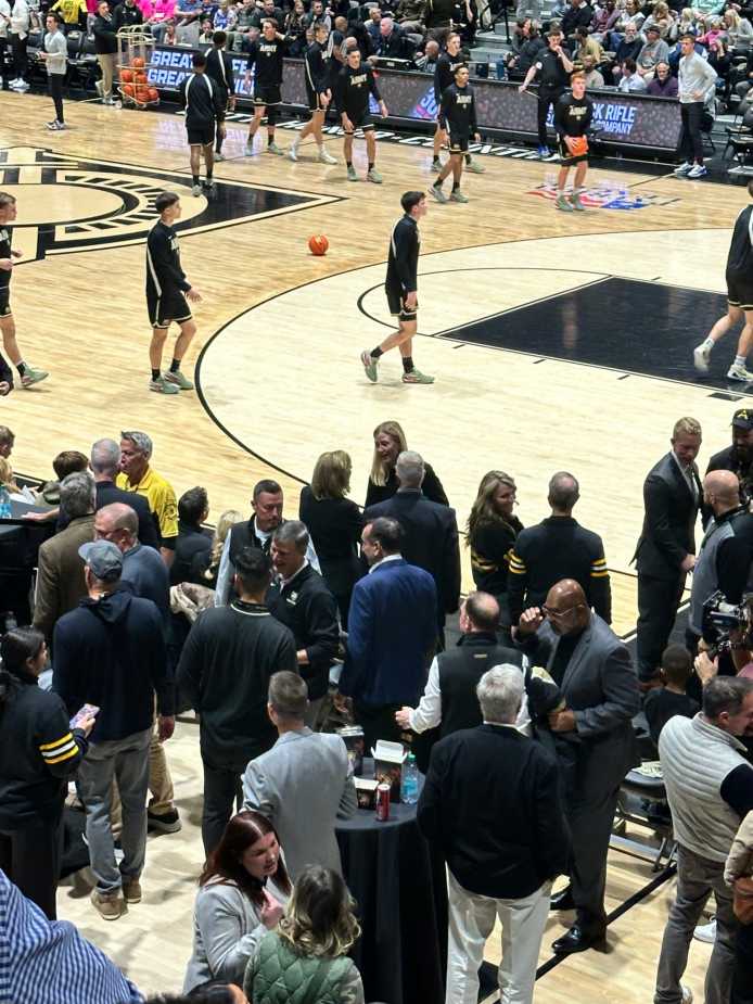 Coach K heads to his seat