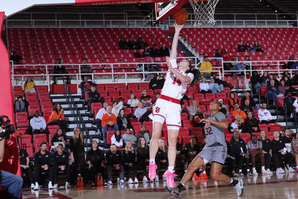 St. John's Red Storm senior forward Kylie Lavelle drives to the basket during Wednesday night's 74-67 upset victory over No. 18/21 Oklahoma State at Carnesecca Arena in Queens, New York.