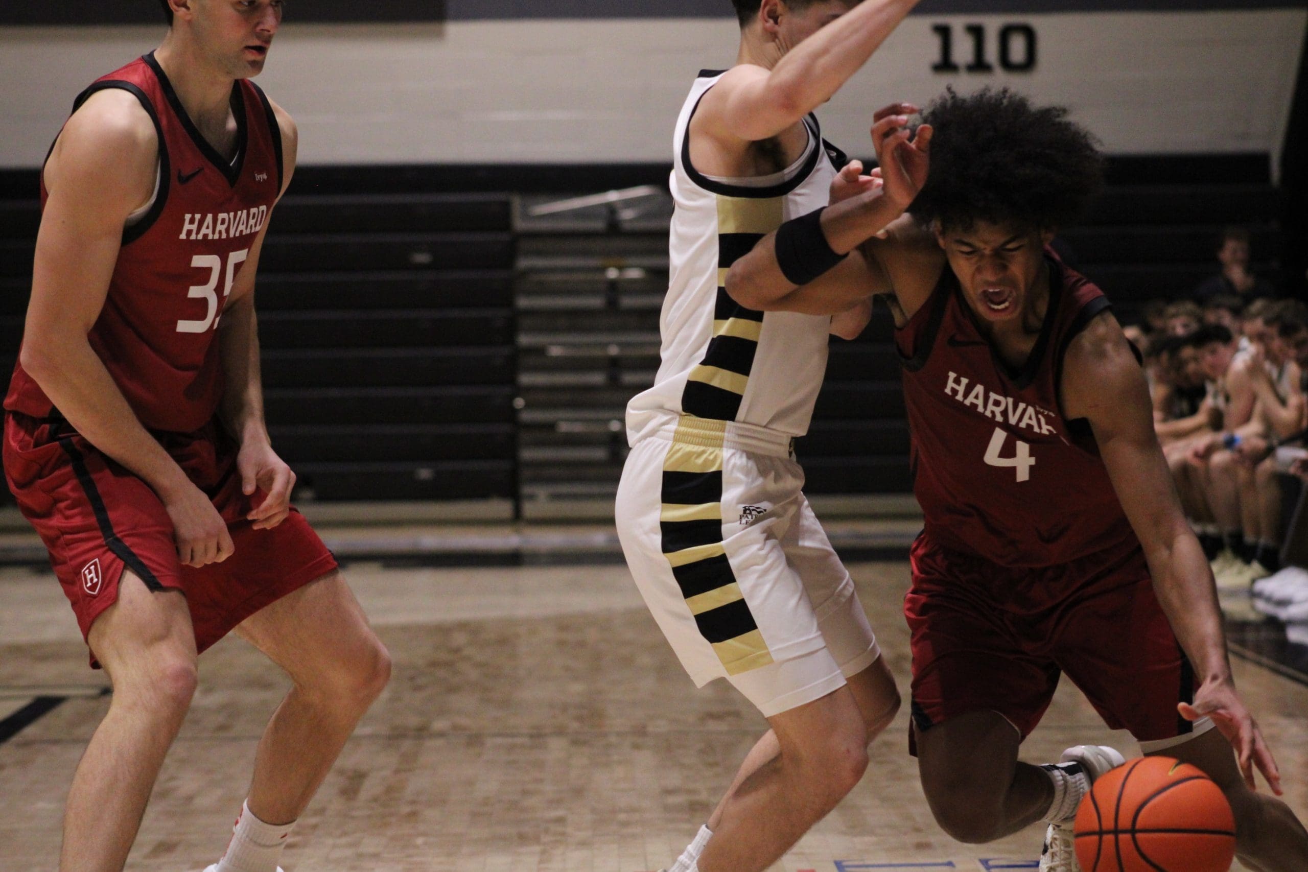 Harvard Crimson Robert Hinton number 4 drives past Army Black Knights freshman Jackson Furman at Christl Arena in West Point