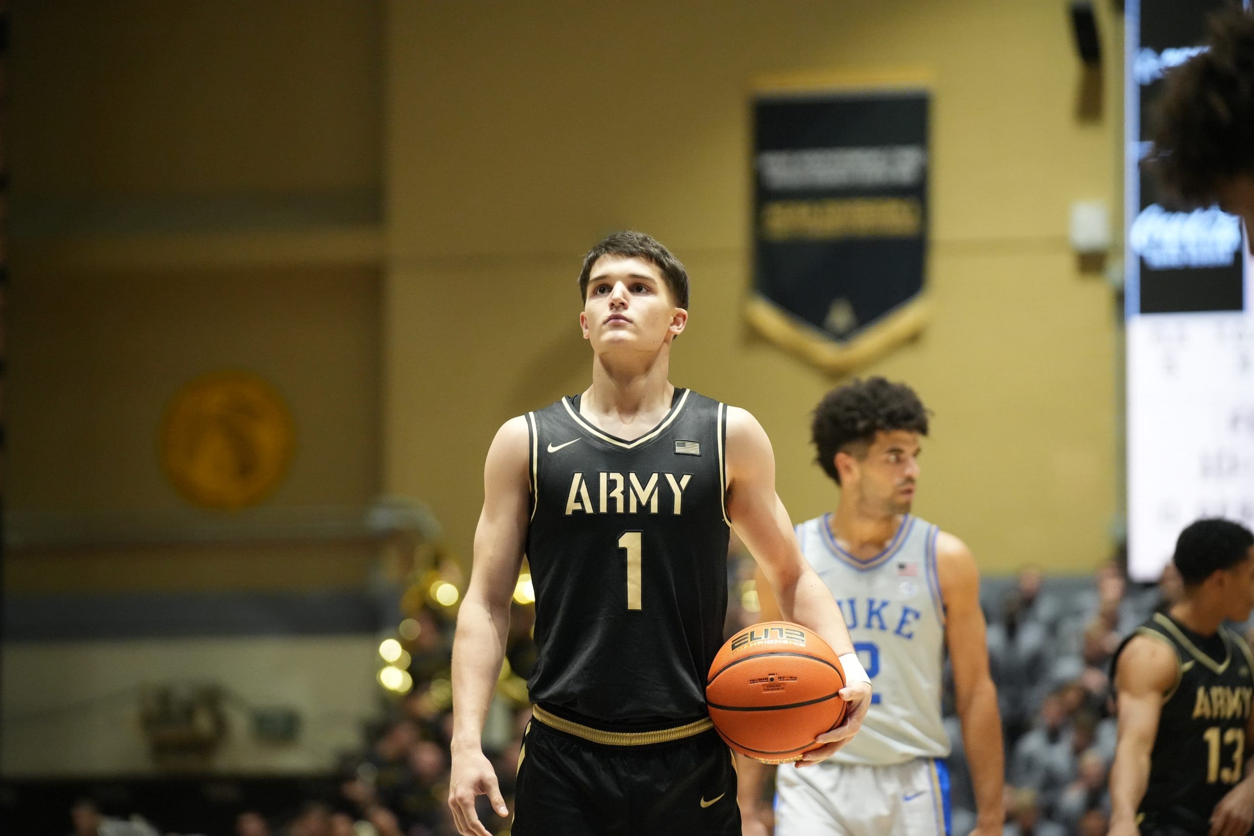 Army West Point freshman guard Jackson Furman (#1) prepares to shoot a free throw during the Black Knights' Veterans Day matchup against Duke at Christl Arena