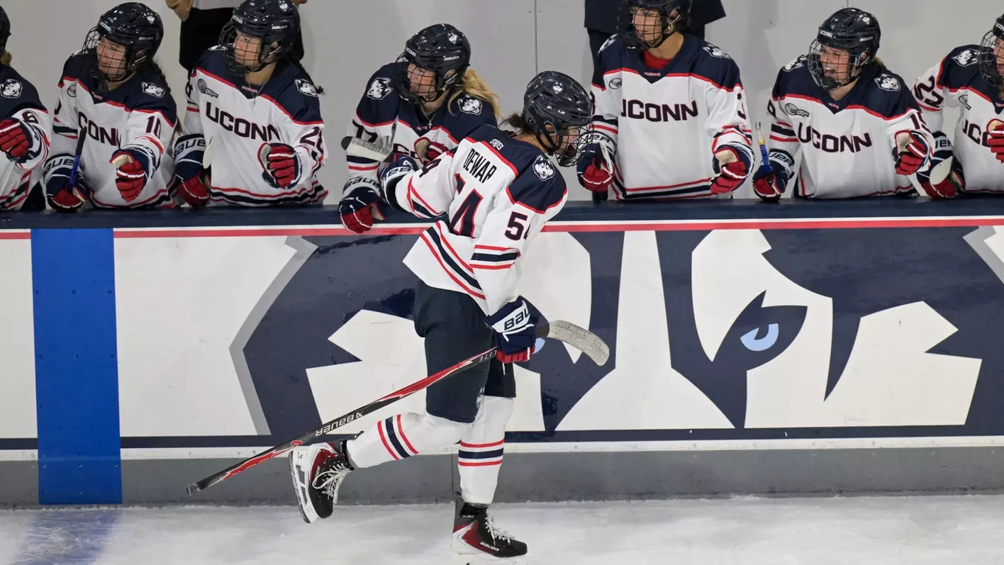 UConn Huskies junior forward Livvy Dewar number 54 celebrates on ice after victory at Toscano Family Ice Forum in Storrs Connecticut