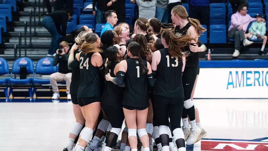 Army West Point volleyball team celebrates together on the court after defeating Colgate 3-2 in five sets to advance to the Patriot League Championship game at Bender Arena in Washington, D.C., on November 21, 2025