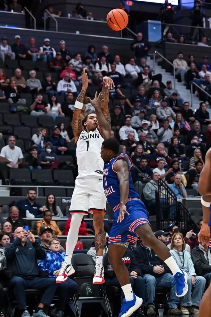 UConn Huskies guard Solo Ball #1 drives against UMass Lowell River Hawks during 110-47 blowout victory at PeoplesBank Arena in Hartford Connecticut on November 7 2025 in NCAA college basketball game