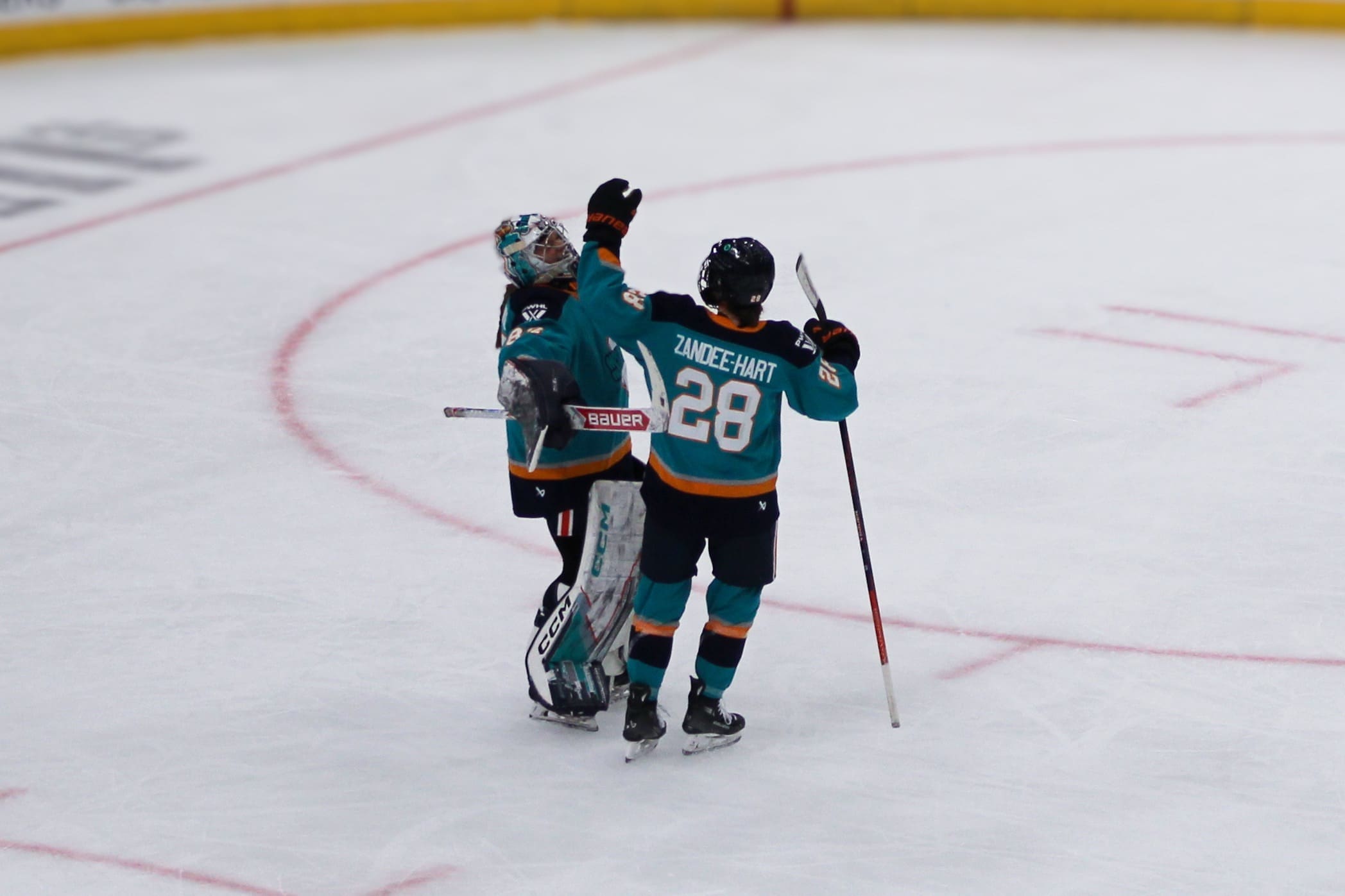 New York Sirens captain Micah Zandee-Hart and goaltender Kayle Osborne embrace in celebration following the team's 5-1 victory over the Vancouver Goldeneyes in their home opener at Prudential Center in Newark, NJ on November 29, 2025