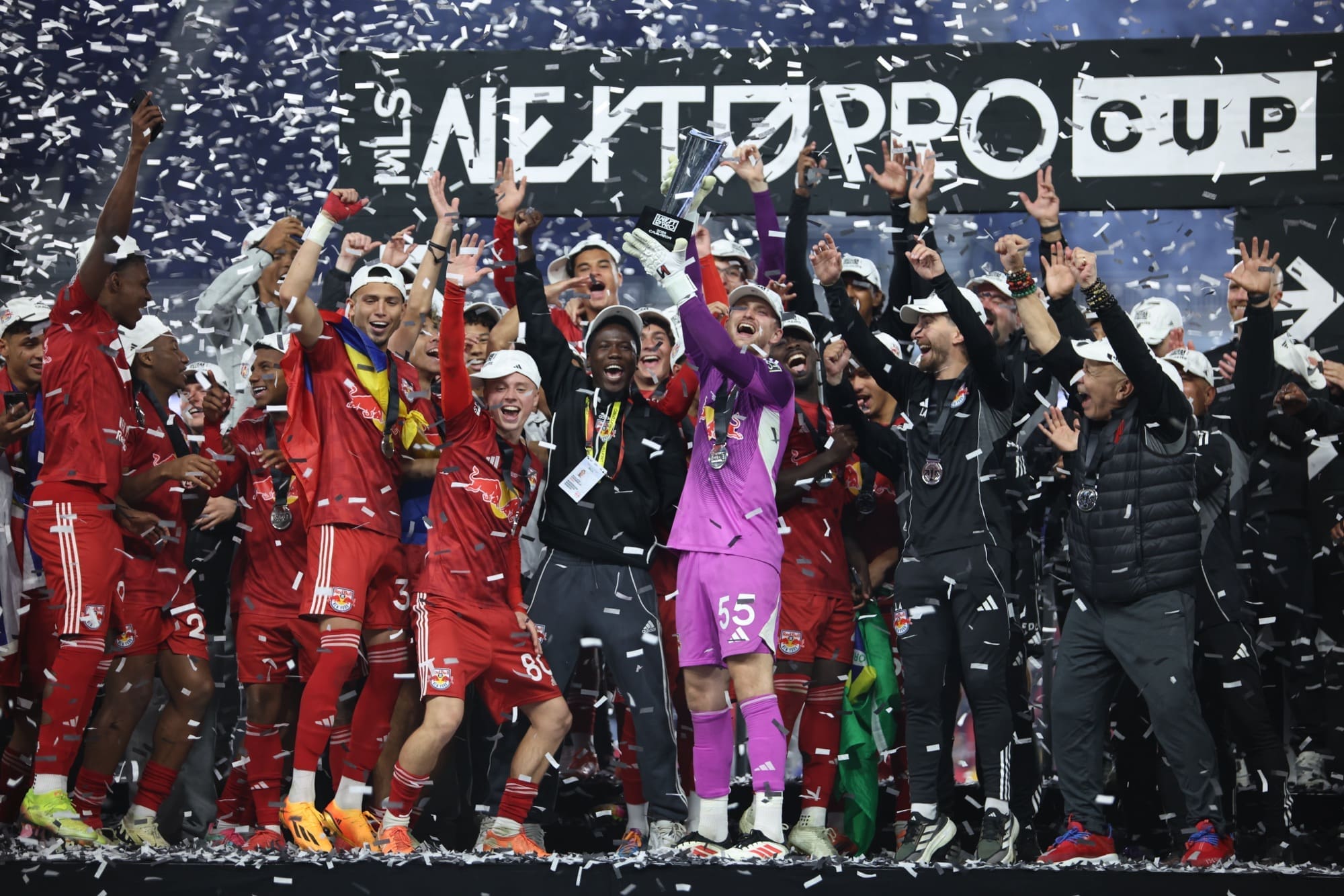 11/8/25, Harrison, New Jersey, Sports Illustrated Stadium. #55 Goalkeeper Austin Causey of New York Red Bulls II holds the MLS NEXT Pro Cup trophy alongside his teammates. in the MLS NEXT Pro Cup Final against Colorado Rapids 2. Mandatory Credit: Jose Pichirilo /Bad Dawg Sports