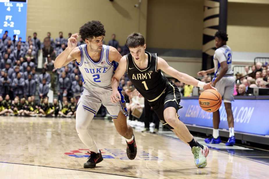 11/08/25, West Point , New York , Christl Arena, Jackson Furman #1 of Army is tightly guarded by Cayden Boozer #2 of Duke during the Army vs. Duke matchup. Mandatory Credit: Bad Dawg Sports/Jose Pichirilo