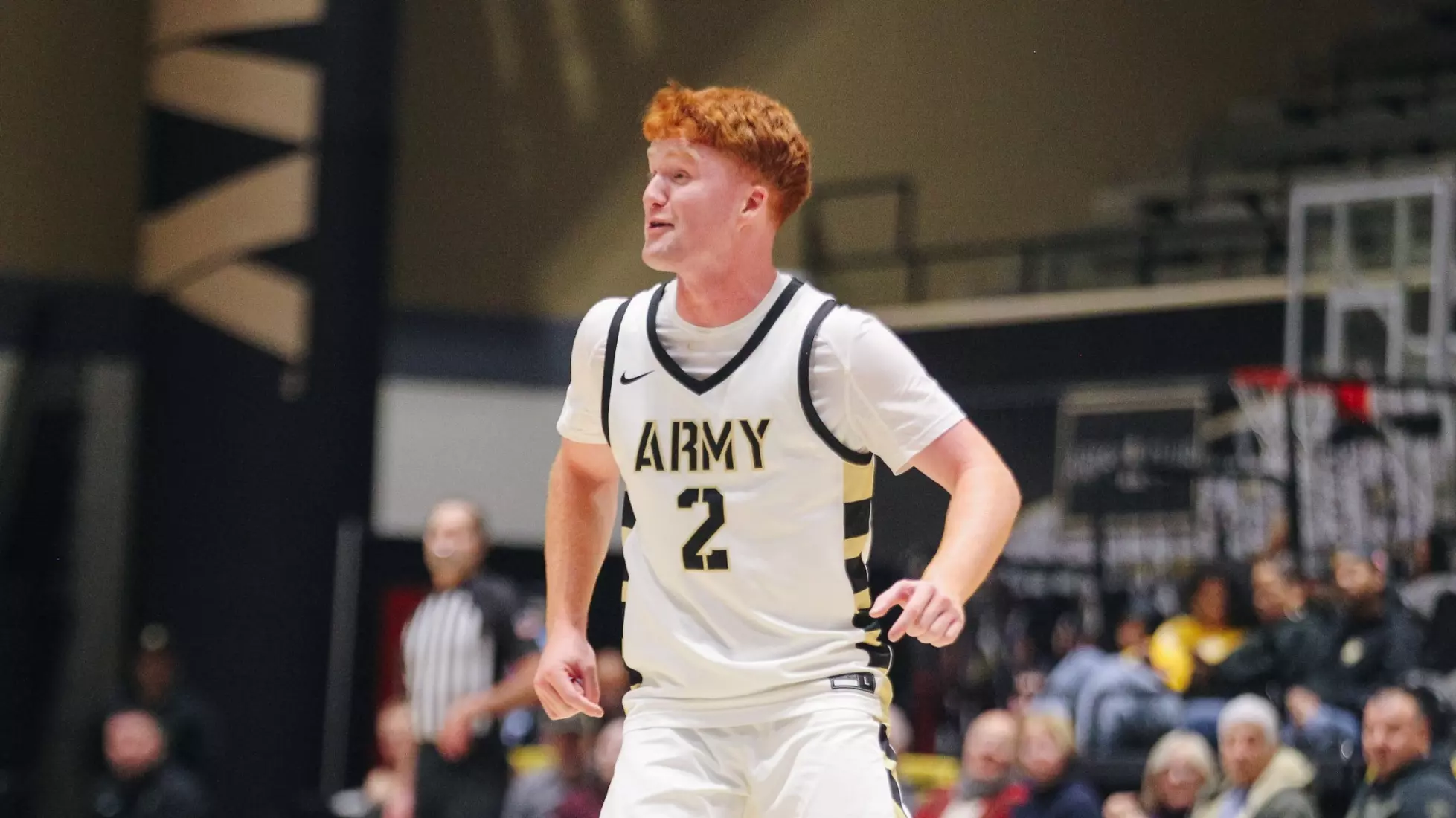 Army West Point guard Ryan Curry dribbles the ball during Army's 81-78 overtime victory over Manhattan at Christl Arena