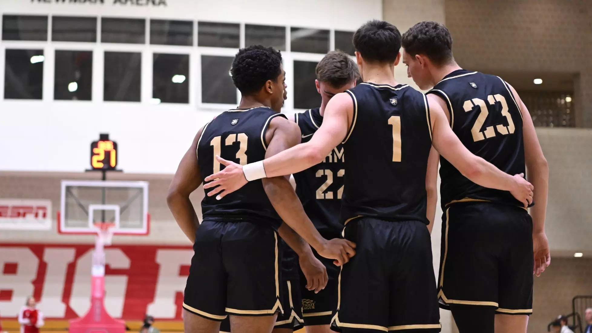 Army West Point men's basketball starting five huddle together before their game against Cornell at Newman Arena in Ithaca, New York, on November 19, 2025