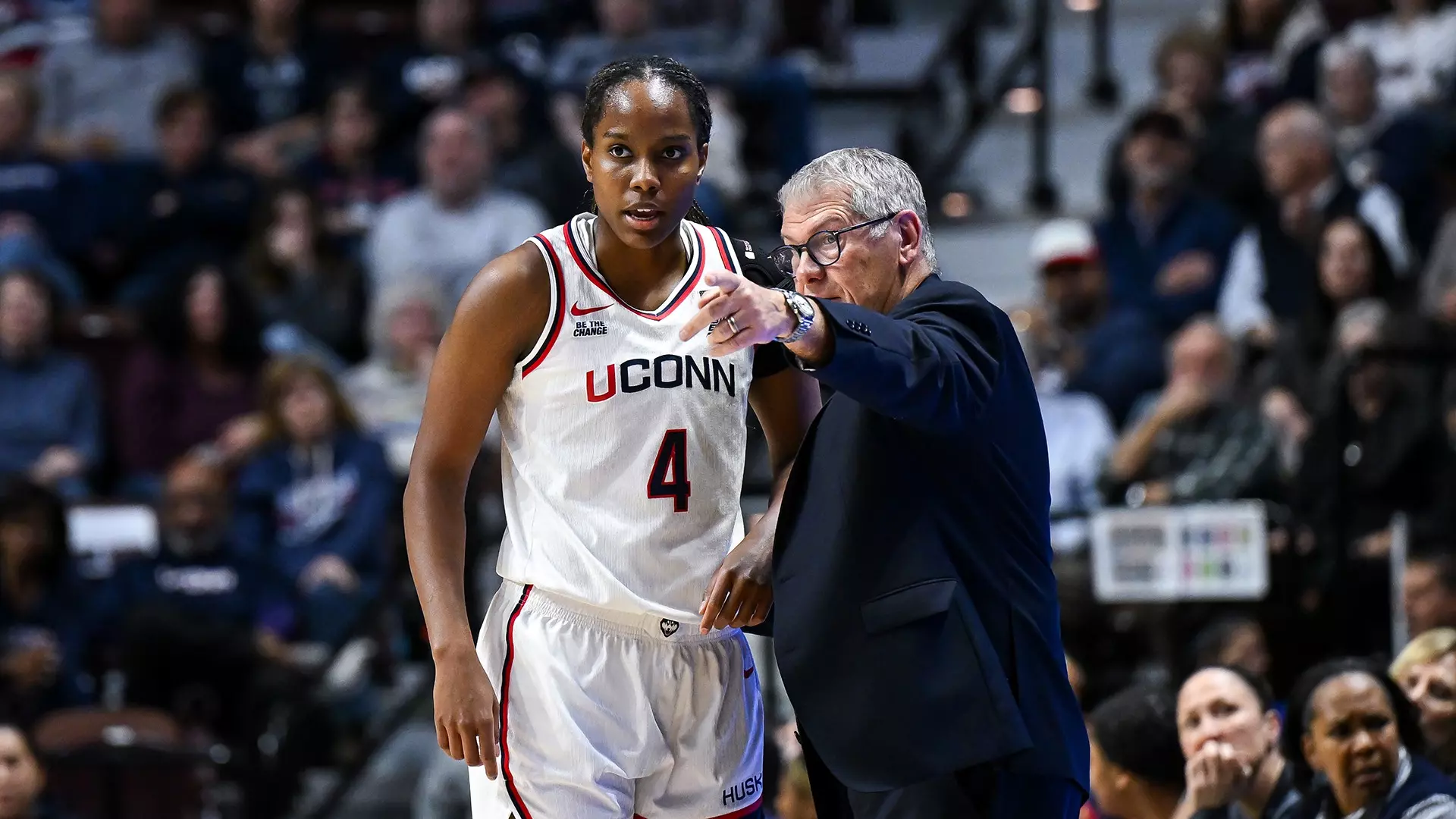 UConn women's basketball head coach Geno Auriemma speaks with freshman forward Blanca Quiñonez during a game at Gampel Pavilion in Storrs, Connecticut