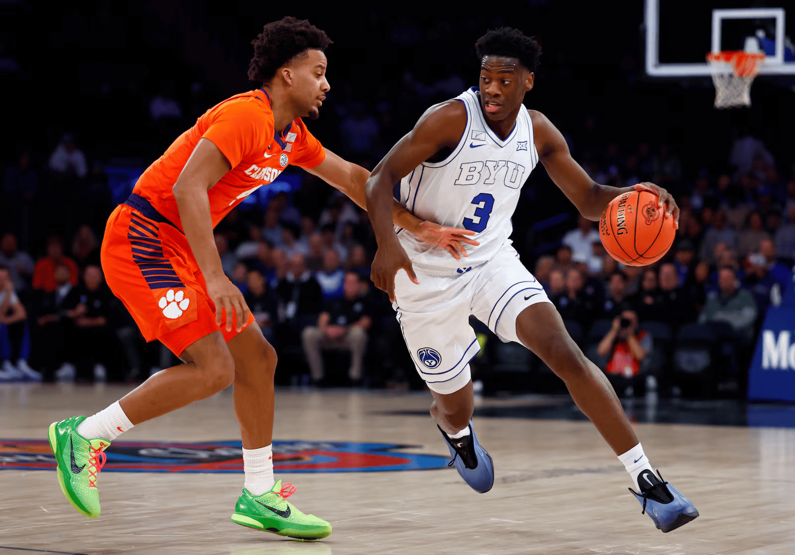 BYU forward AJ Dybantsa (3) drives past Clemson guard Efrem Johnson (4) during the first half of an NCAA college basketball game at Madison Square Garden.
