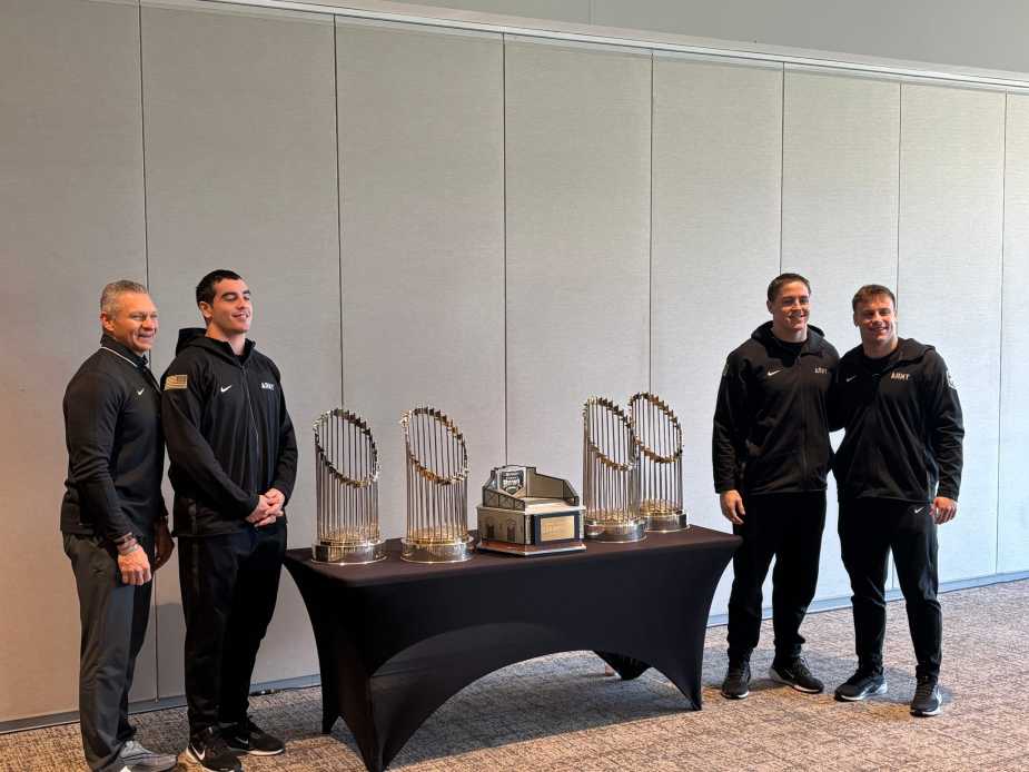 Army with the trophies after press conference.