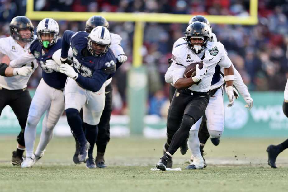 12/27/25, Boston, Massachusetts , Fenway Park. (#7) Godspower Nwawuihe of the Army Black Knights runs for a 43-yard touchdown during the first half of the Wasabi Fenway Bowl Mandatory Credit: Jose Pichirilo / Bad Dawg Sports