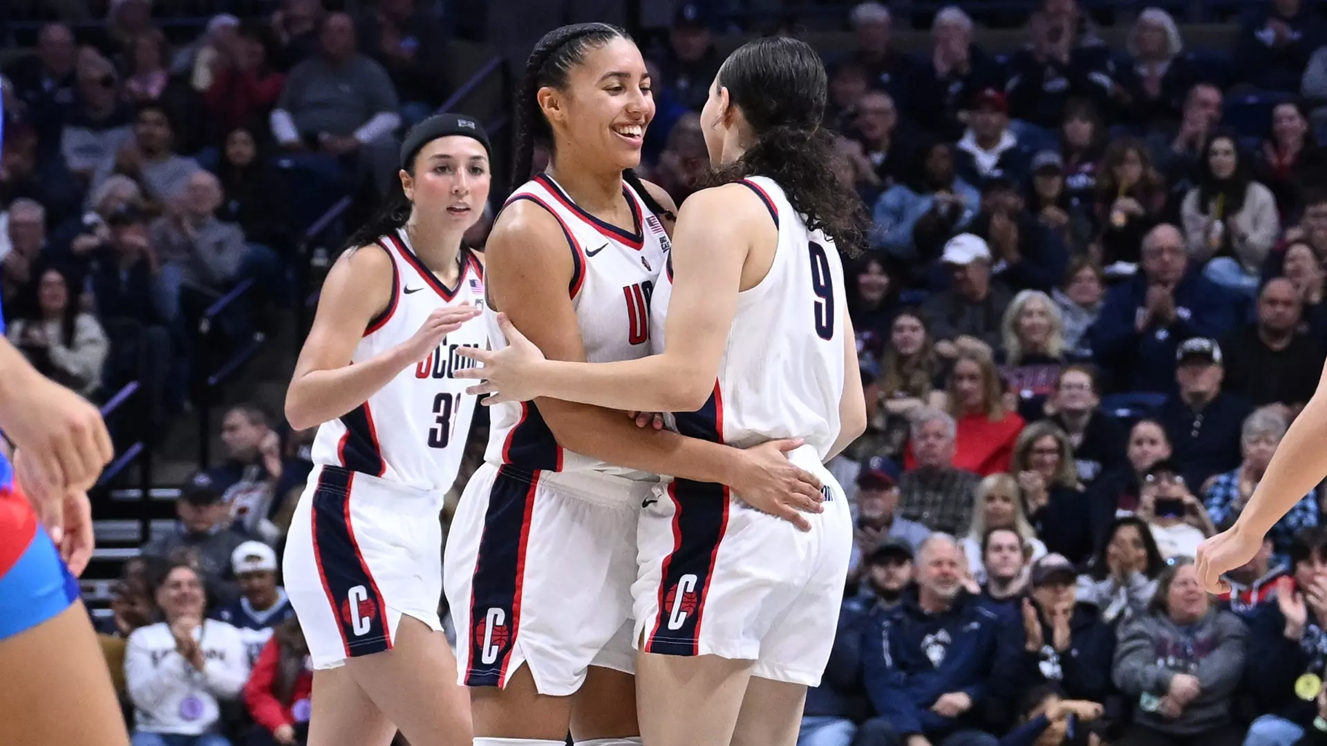 UConn’s Sarah Strong drives past DePaul defenders during the Huskies’ 102-35 win at Gampel Pavilion.