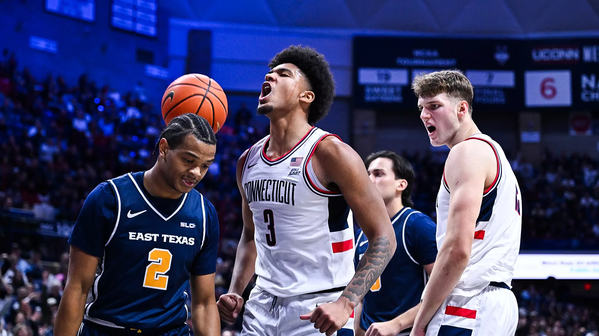 UConn Huskies guard Solo Ball drives to the basket against East Texas A&M defender during the second half at Gampel Pavilion on December 5, 2025.