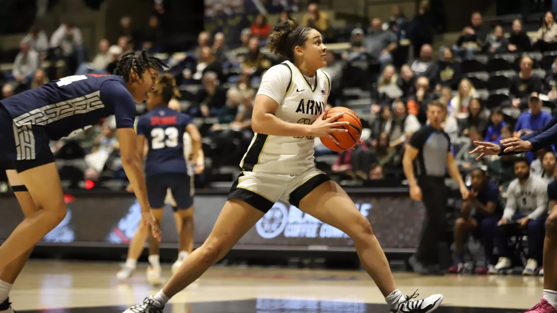 Army Black Knights forward Kya Smith drives to the basket against Howard defenders during a women’s basketball game at Christl Arena.