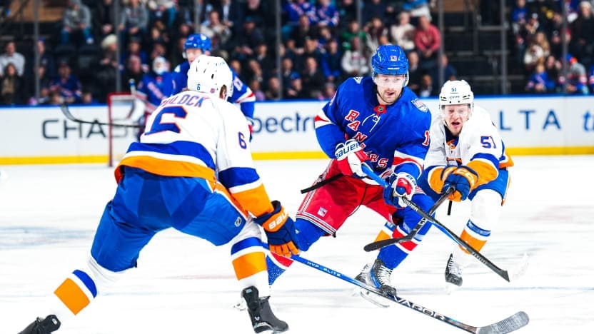1/29/2026 Madison Square Garden, New York, NY., Alexis LAfreniere skates between two Islanders players. Mandatory Credit: New York Rangers