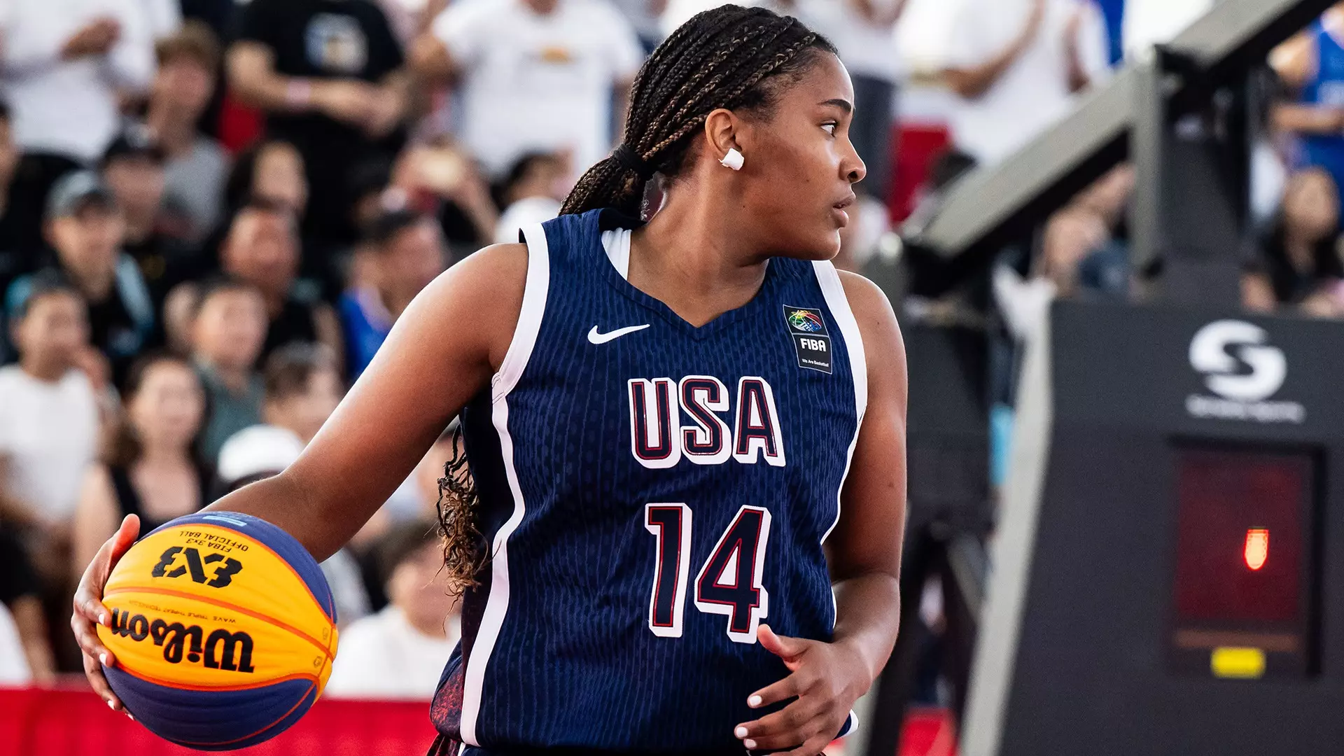 Sarah Strong wearing a USA Basketball jersey (#14) holds a 3x3 basketball during the FIBA 3x3 tournament. Mandatory Credit: USA Basketball