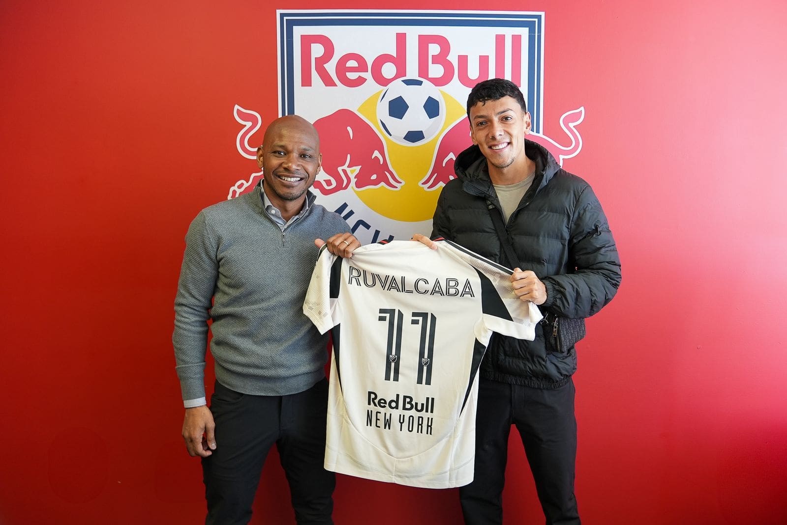 2/2/2026 Red Bull TRaining Faciltiy, East Hanover, NJ., Jorge Ruvalcaba and Director of Sport Julian DeGuzman holding a jersey after the signing was official. Mandatory credit: Red Bull New York