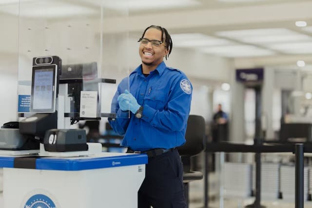 A Transportation Security Administration security officer stands duty at a security checkpoint at Ronald Reagan Washington National Airport in Arlington, Va., Feb. 11, 2025. Mandatory Credit: Julian Belyea, TSA