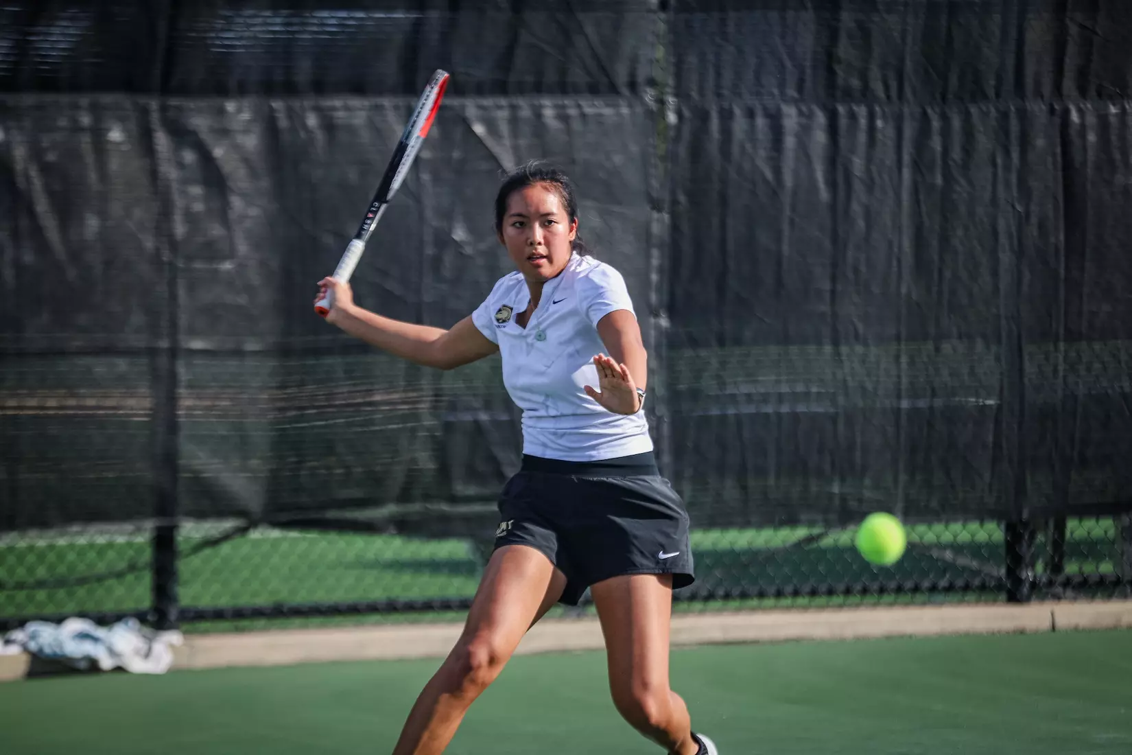 Army West Point women’s tennis player Ylan Duong hits a forehand during match play. Mandatory Credit: Army West Point Athletics.