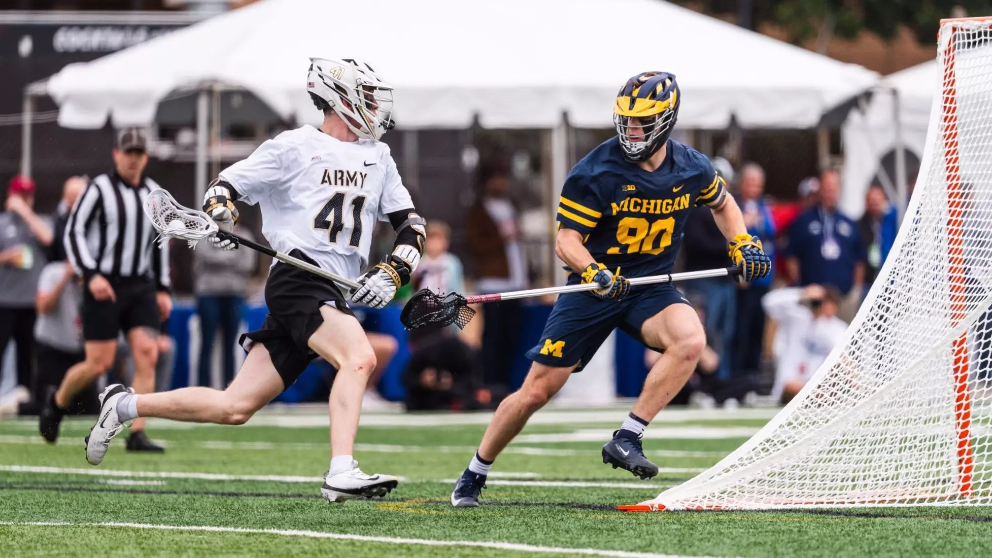 No. 10 Army's Gunnar Fellows (41) attacks the Michigan goal during a 13-11 victory in Atlanta.