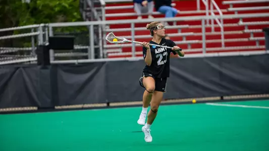 Army’s Allison Reilly cradles the ball in open space during an Army West Point women’s lacrosse game.